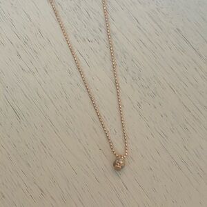 Gold skull and diamond necklace